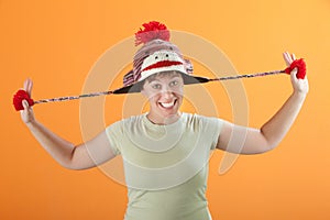 Woman Pulling Her Hat