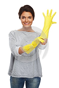 Woman pulling on rubber gloves