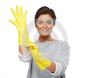 Woman pulling on rubber gloves