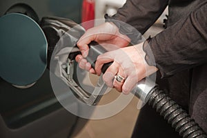 Woman Pumping Gasoline