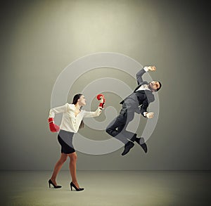 Woman punching businessman