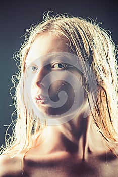 Woman with pure skin and wet hair after shower