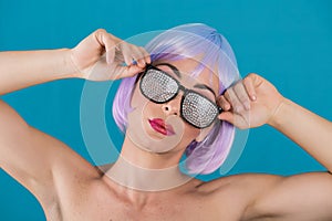 Woman with purple hair in glamour glasses