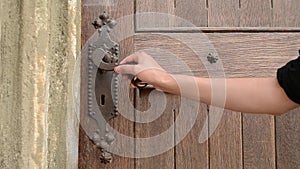 Woman Push Old Door Handle