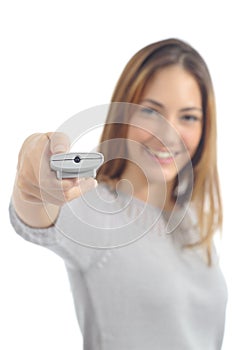 Woman pushing a button on a remote control