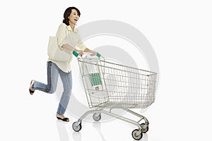 Woman pushing a shopping cart
