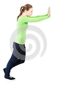 Woman pushing something imaginary