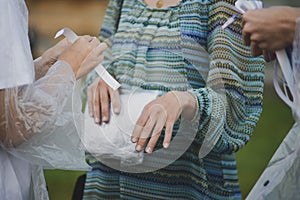 The woman is put on the admission ticket on the wrist