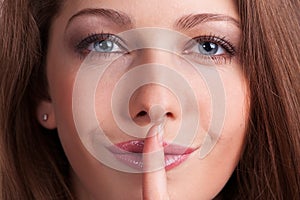 Woman put a finger to her lips