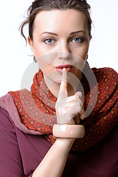 Woman put her finger to her lips