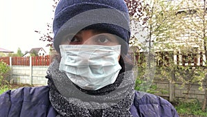 Woman put on mask, making selfie