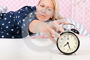 Woman put out the alarm clock