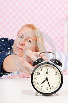 Woman put out the alarm clock