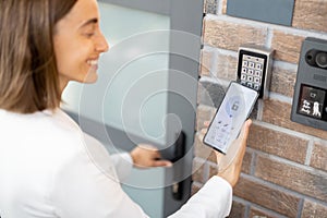 Opening door with a smart phone and keyboard on the wall