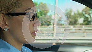 Woman puts on and takes off glasses while driving, blurred vision, asthenopia