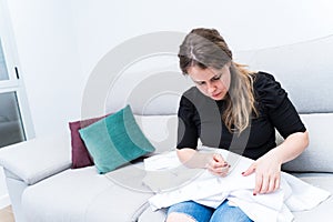 Woman putting accessories on a curtain, home life, lifestyles. Derocation