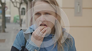 Woman putting on bite splint and face mask, COVID-19 lifestyle