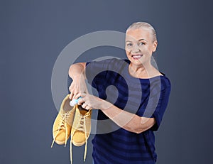 Woman putting capsule shoe freshener in footwear