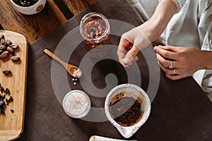 Woman putting chili pepper in organic handmade artisanal chocolate