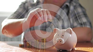 Woman putting coin in piggy bank, saving money concept. Future needs loan education or mortgage credit spend vacation of