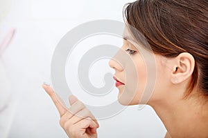 Woman putting a contact lens