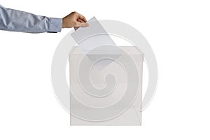 Woman putting her vote into ballot box on white, closeup