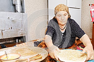 Woman putting raw bread on board