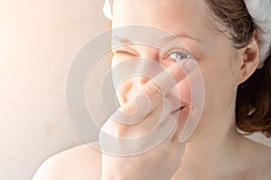 Woman putting soft hydrogel contact lenses on her eyes