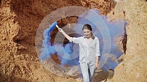 woman in rabbit ears waving red smoke bombs. Outdoors lifestyle portrait