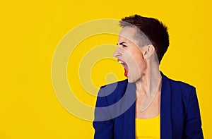 Woman in rage in side profile view screaming