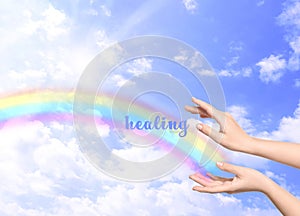 Woman and rainbow as source of healing energy on sunny day