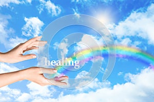 Woman and rainbow as source of healing energy on sunny day