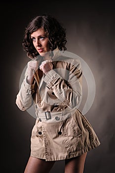 Woman with raincoat fashion portrait