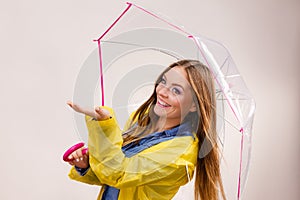 Woman in rainproof coat with umbrella. Forecasting