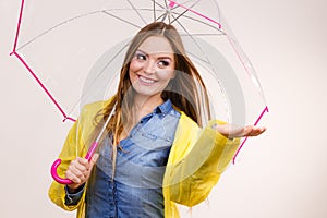 Woman in rainproof coat with umbrella. Forecasting