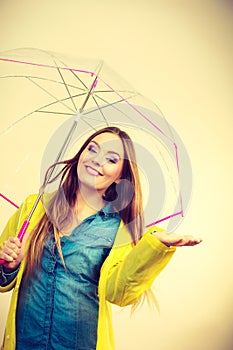 Woman in rainproof coat with umbrella. Forecasting