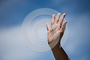 Woman raise hand up showing the five fingers photo