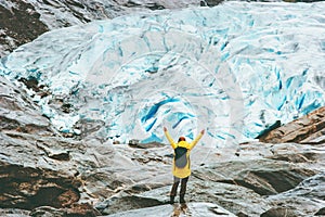 Woman raised hands traveling in Norway