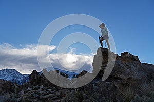 A Woman Reaches The Top Of A Windy Tungsten Peak