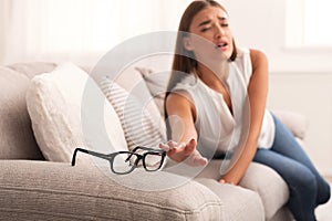 Woman Reaching Hand For Eyeglasses Having Bad Eyesight At Home