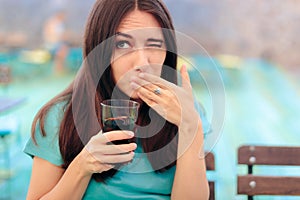 Woman Reacting after Having a Fizzy Soda Drink