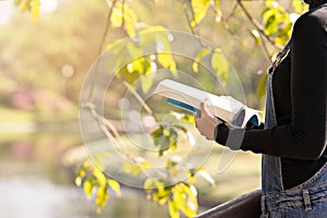 Woman read a book in garden for education