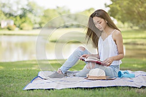 woman read book at summer park