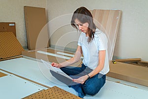 Woman Reading Assemble the furniture Manual