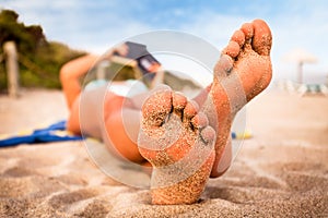 Woman reading on the beach.