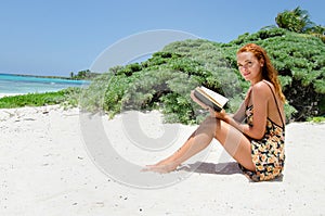 Woman reading at beach