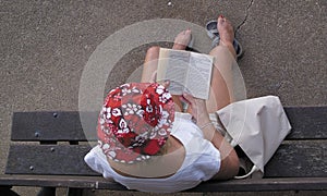 Woman reading on bench