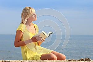 Woman reading book girl yellow dress