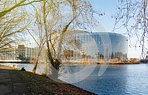 Woman reading a book near the European PArliament building