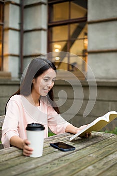 Woman reading on book